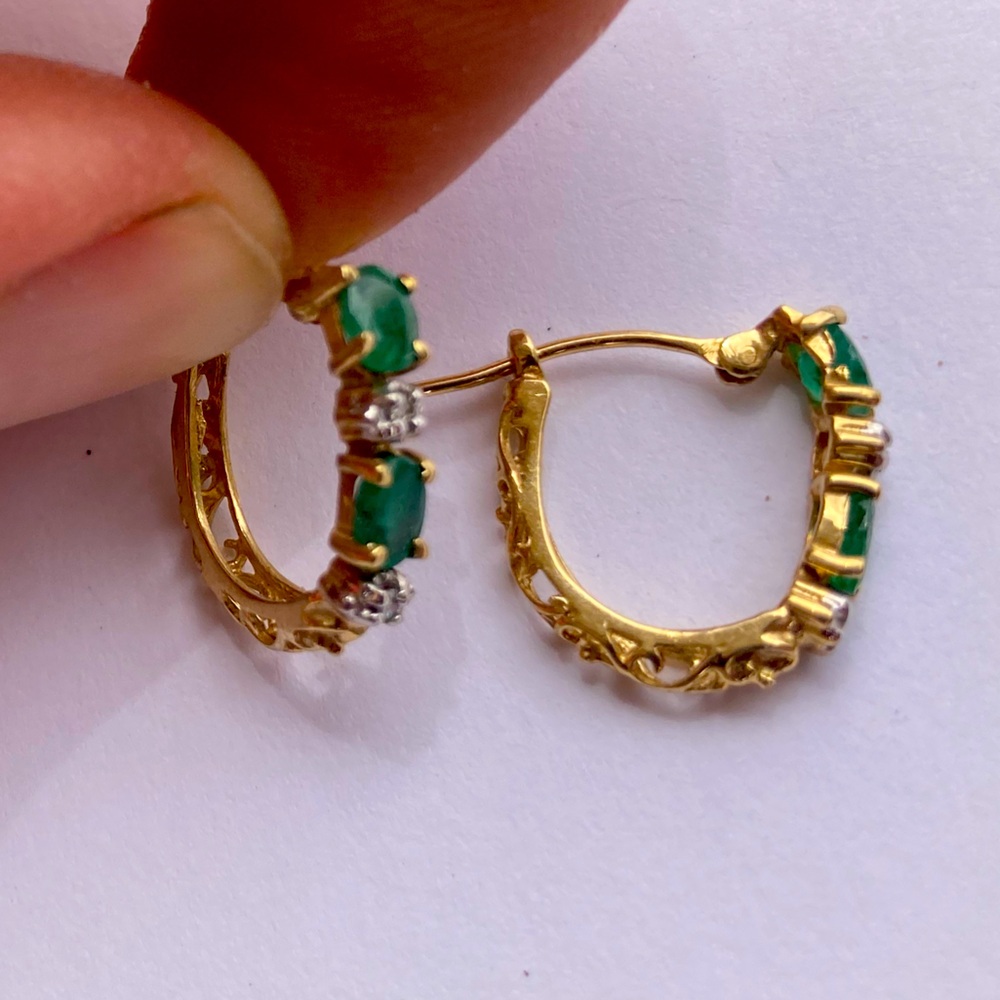 Gold filigree hoop earrings with green gems